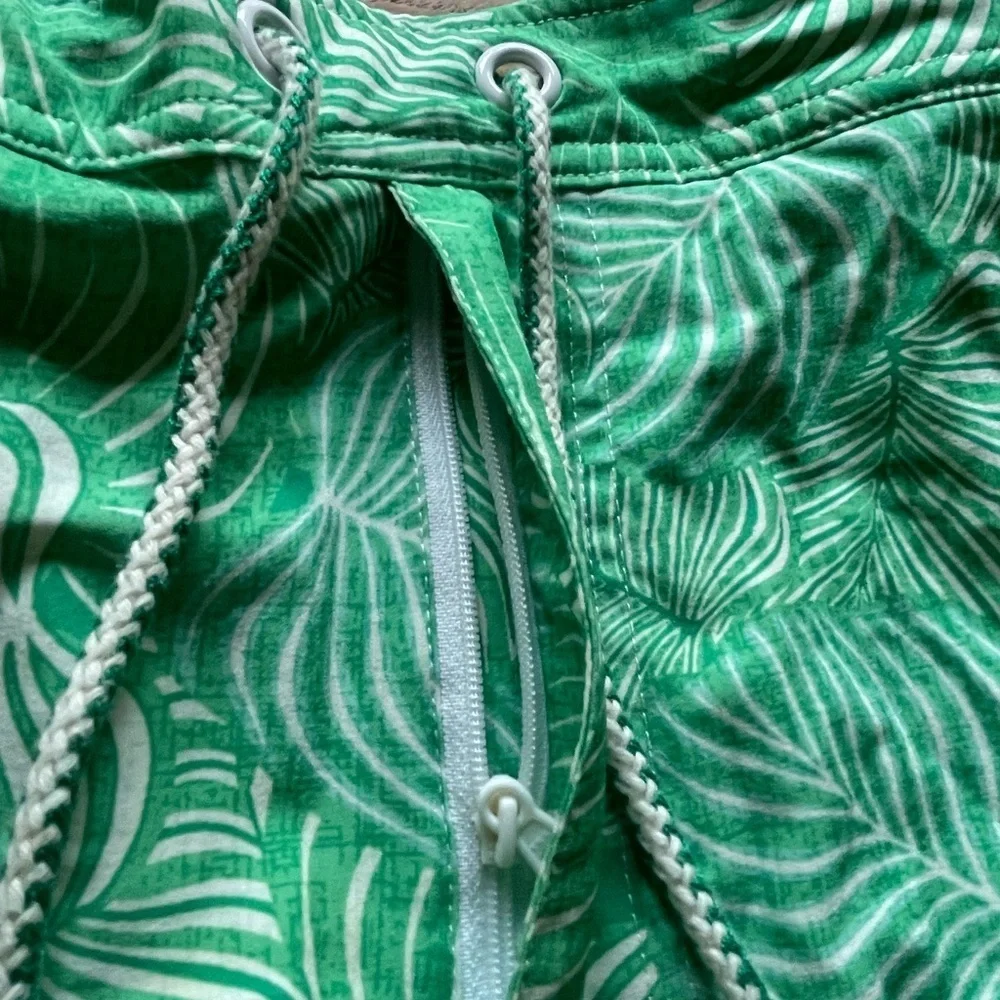 Johnnie-O swim shorts- green leaf design- size men’s large elastic in back.